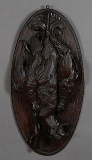 Carved Walnut Black Forest Natur Morte Plaque, 19th c., of oval form, with high relief carving of two birds and a gemsbok, H.- 27 in., W.- 14 in., D.-