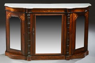 English Victorian Carved Mahogany Marble Top Credenza, 19th c., the bowed serpentine figured white marble on a base with a central mirror door flanked