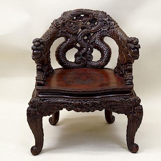 20th Century Chinese High Relief Carved Hardwood Chair.