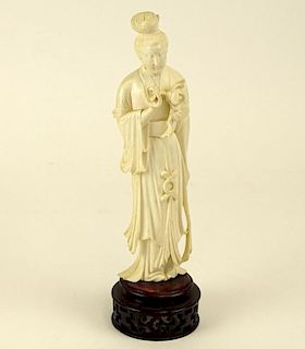Chinese Carved Ivory Guanyin figure on carved wood base.
