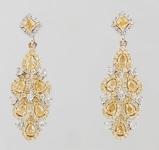 Pair of 14 Yellow and White Gold Pendant Earrings, with yellow diamonds atop white diamond borders, yellow diamond weight- .93 cts., yellow and white 