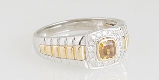 Man's 14K Yellow and White Gold Dinner Ring, with a cushion cut .6 carat fancy deep brown cushion cut diamond, within a diamond mounted border, flanke