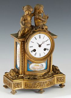 French Bronze and Sevres Mounted Figural Mantel Clock, 19th c., with two musical putti surmounts, over an enamel dial time and strike drum clock, abov