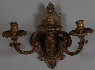 Bronze Three Light Wall Sconce, 19th c., the shaped back plate with a relief Bacchus head and grapes, issuing three double curved arms, to reeded carv