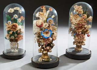 Three English Victorian Display Domes, 19th c., with wax fruit and flowers, in blown glass domes with ebonized bases, H.- 14 1/2 in., Dia.- 5 1/2 in. 