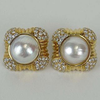 Lady's Large Approx. 5.70 Carat Round Cut Diamond, 17mm Mabe Pearl and 14 Karat Yellow Gold Earrings.