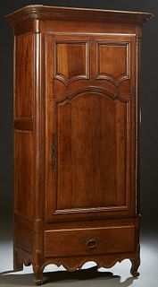 French Provincial Louis XV Style Carved Cherry Bonnetiere, c. 1820, the stepped rounded crown over a door with three fielded panels, a long iron escut