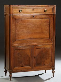 French Louis XVI Style Carved Mahogany Secretary Abattant, 19th c., the cookie corner top over a frieze drawer and an inset leather fall front enclosi