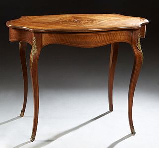 French Inlaid Mahogany Ormolu Mounted Center Table, early 20th c., the marquetry and line inlaid top over a wide skirt, with one long frieze drawer, o