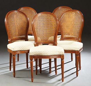 Set of Five Louis XVI Style Dining Chairs, the arched curved cane back over an upholstered bowed seat, on reeded tapered legs, in white "diamond" velv