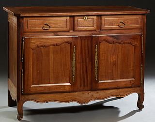 French Provincial Louis XV Style Carved Cherry Sideboard, 19th c., the canted corner top over three frieze drawers and double cupboard doors with iron