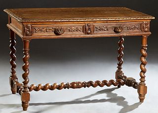French Provincial Henri II Style Carved Oak Writing Table, c. 1880, the stepped carved edge top over two frieze drawers with fox head handles, on rope