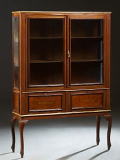 French Louis XV Style Carved Inlaid Mahogany Vitrine, c. 1910, the stepped crown over double glazed doors above inlaid fall front storage areas, flank