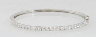 Lady's 14K White Gold Hinged Bangle Bracelet, one half mounted with 28 prong set round diamonds, total diamond weight- 1.93 cts., H.- 2 in., W.- 2 1/4