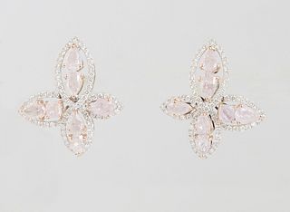 Pair of 18K White Gold Earrings, of X-form, the four arms with center pink diamonds within a border of tiny round diamonds, with screw backs, pink dia
