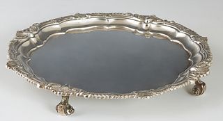 English Sterling Footed Plate, 1935, London, by the Goldsmiths and Silversmith's Company, London, with a scalloped relief gadroon and shell edge, on f