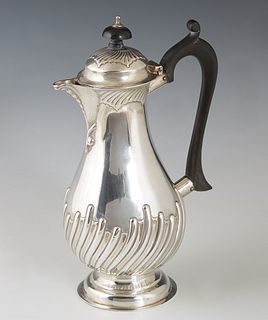 English Sterling Chocolate Pot, 1897, Sheffield, by Alexander Clark, with an ebonized wood handle and top of the lid, the sides with relief wave decor