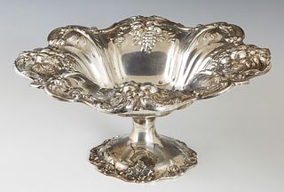 Sterling Silver Compote 20th c., by Reed and Barton, in the "Francis I" pattern, #X567, the scalloped rim with repousse fruit decoration, H.- 5 1/2 in