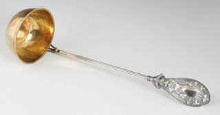 American Aesthetic Sterling Silver Punch Ladle, c. 1880, attributed to Whiting, the wide spoon form handle with a relief bird and ivy leaves, on a ree
