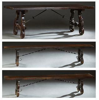 French Provincial Carved Oak Monastery Table, 19th c., the thick three board rectangular top on large pierced trestle supports, joined by wrought iron