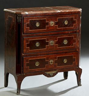 French Louis XVI Style Ormolu Mounted Inlaid Mahogany Marble Top Commode, early 20th c., the stepped canted corner figured rouge marble over three dra