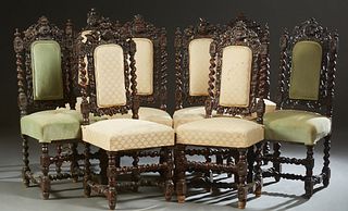 Set of Eight Continental Carved Oak Dining Chairs, c. 1880, the pierce carved arched backs with relief carved grape bunches, leaves and flowers, six w