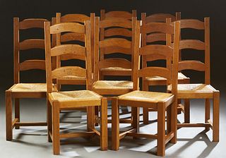 Set of Eight French Carved Oak Ladderback Rush Seat Side Chairs, 20th c., the canted back over a slip rush seat, on square legs, joined by square stre