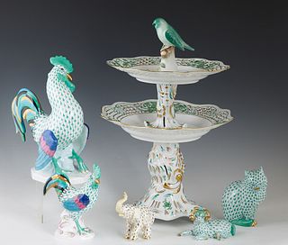 Group of Six Herend Porcelain Items, 20th c., Hungary, consisting of a three tier cake dish with a bird finial; a large rooster; a small rooster; an e