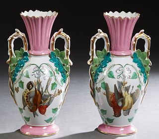 Pair of Continental Polychromed Porcelain Baluster Vases, 20th c., the reeded tapered pink neck over shoulders with ring handles and Natur Morte reser