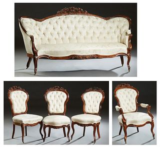 American Victorian Rococo Revival Carved Rosewood Five Piece Parlor Suite, 19th c., consisting of a settee, a fauteuil, and three side chairs, each wi
