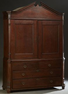 English Carved Oak Regency Style Linen Press, 19th c., the peaked broken arch crown over double doors with canted rounded pilasters, on a canted corne