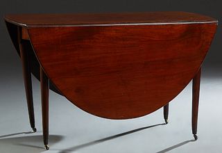 English Carved Mahogany Demi-Lune Dining Table, 19th c., the oval top on four tapered cylindrical legs with brass cap casters, H.- 28 3/4 in., Closed 