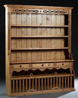 Louisiana Carved Pine Kitchen Cabinet, late 19th c., the stepped top over a latticework panel, above three rear plate racks, over three frieze drawers
