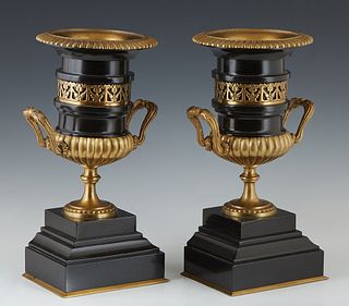 Pair of Gilt Bronze Mounted Black Marble Garniture Urns, 19th c., the everted ribbed bronze rim over a pierced bronze inset band, above double handles