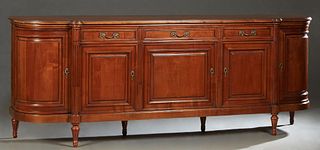 French Louis XVI Style Carved Cherry Marble Top Sideboard, 20th c., the stepped serpentine top over two frieze drawers above double fielded panel cupb