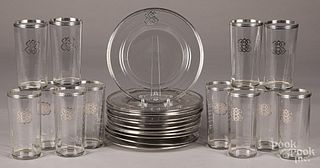 Twelve sterling silver mounted plates and glasses