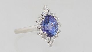 Lady's Platinum Dinner Ring, with an oval 2.5 carat tanzanite atop a border of diamond "points," total diamond weight- .52 cts., size 6 1/2, with appr