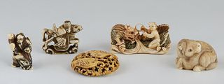 Group of Five Carved Ivory Netsukes, early 20th c., one of a man and a dragon, signed; one of two fish in a circle, signed; one of a man riding a hors