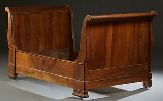 French Louis Philippe Carved Walnut Lit du Coin, 19th c., the scrolled head and foot board joined by a deep wood front rail and a narrow wood rear rai