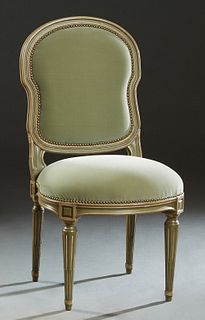 French Polychromed Carved Beech Louis XVI Style Side Chair, early 20th c., the cushioned shield back over a rounded cushioned seat, in green velvet up