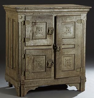 Early Munschauer Ice Box, early 20th c., with a hinged top for ice blocks, over three incised carved doors, on a plinth base on block feet, H.- 45 in.