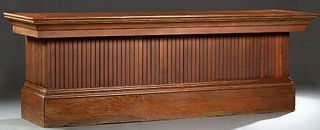 Louisiana Carved Cypress Store Counter, early 20th c., with a beaded board front and sides, with four open rear shelves, on a plinth base, H.- 36 1/4 