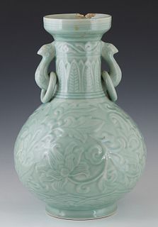Large Chinese Celadon Baluster Vase, 19th c., the neck with bird form ring handles, relief decorated overall with flowers, H.- 15 in., Dia.- 10 in.