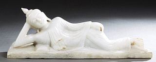 Asian Carved Alabaster Figure of a Reclining Buddha, 20th c., lying on his right side with his hand supporting his head, dressed in a sanghati with ri