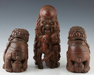 Group of Three Chinese Carved Bamboo Figures, early 20th c., consisting of a pair of Foo lions and a sage, Sage- H.- 12 1/2 in., W.- 5 in., D.- 7 in.