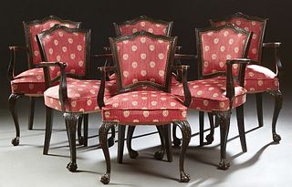Set of Six Louis XV Style Ebonized Carved Beech Armchairs, 20th c., the serpentine canted cushioned shield back over a cushioned seat flanked by curve
