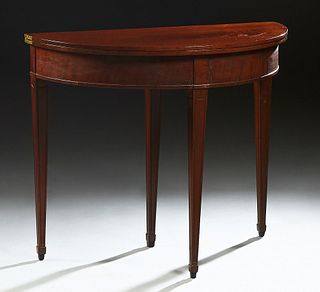 French Carved Mahogany Louis XVI Style Demilune Games Table, 20th c., on tapered square legs, H.- 29 1/2 in., W.- 35 in., D.- Closed- 17 1/2 in., Open