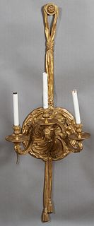 Large Louis XV Style Three Light Wall Sconce, 20th c., the twisted garland and swirled leaf back plate issuing three large scrolled arms with relief b