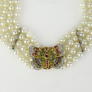 Lady's Vintage Four Strand 6mm Pearl Necklace with Diamond, Sapphire, Ruby, Emerald and 14 Karat Gold Butterfly Clasp.