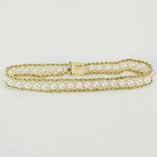 14 Karat Yellow Gold and Pearl Ladies Bracelet with Safety Lock.